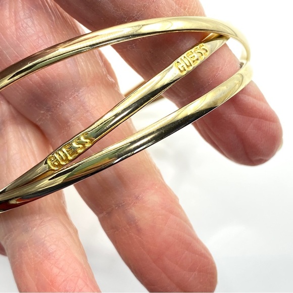 GUESS Gold Interlinked Thin Bangles Set of Three - Picture 5 of 6